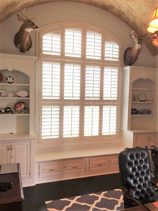 Plantation shutters in a tudor style home